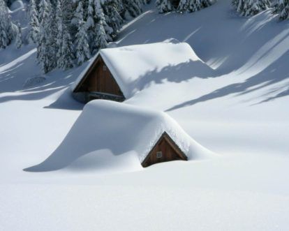 Home covered with snow